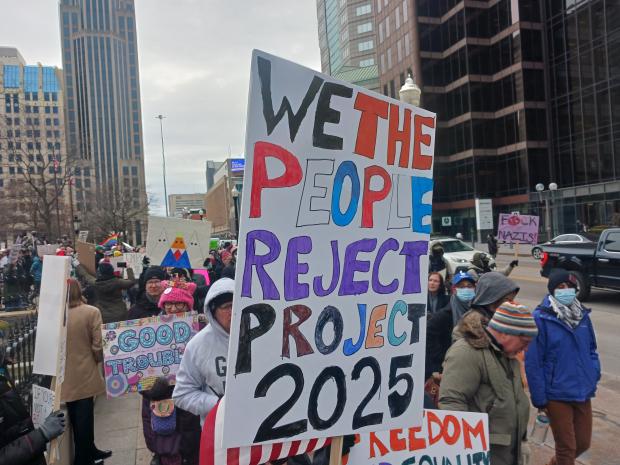 Sign saying We the People reject Project 2025