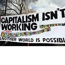 Big banner outside saying Capitalism Isn't Working Another World is Possible