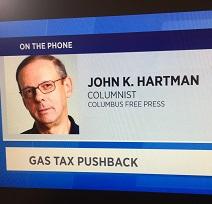 Screen shot of white man's head and the words John K. Hartman Columnist Columbus Free Press on the phone Gas Tax Pushback