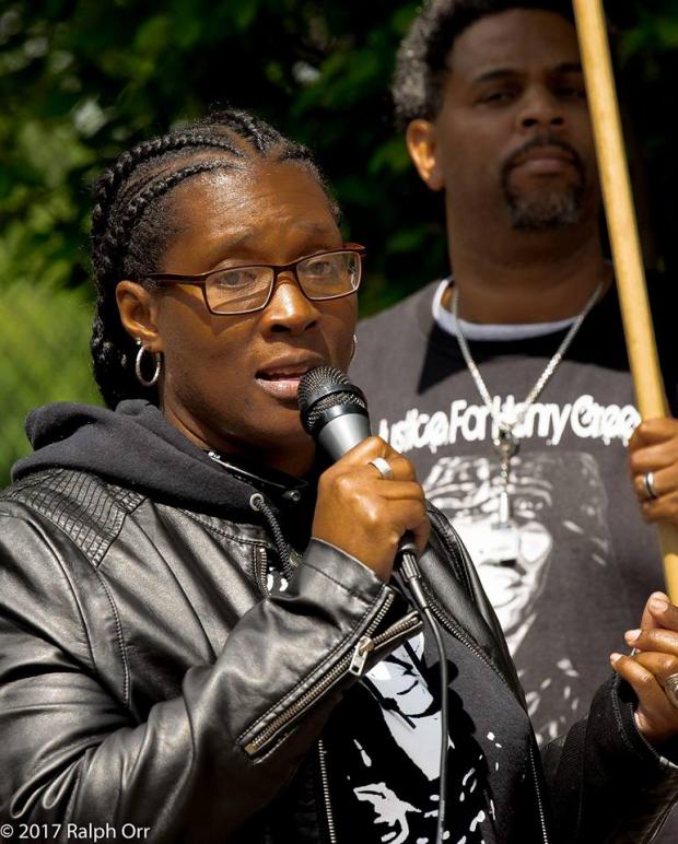 Black woman talking into a mic