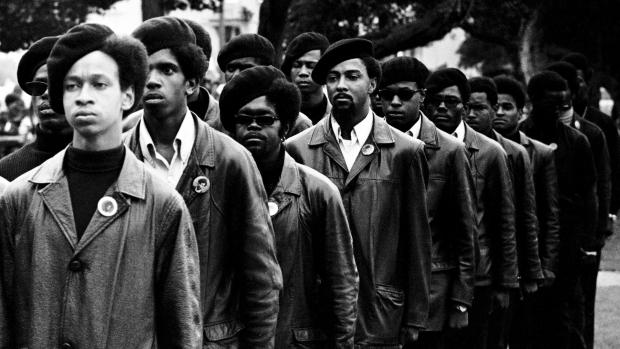 Black Panthers in berets in black and white photo