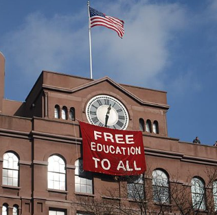 College building with sign Free Education to all