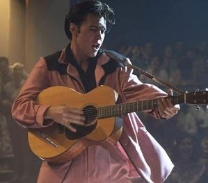 Elvis playing guitar and singing