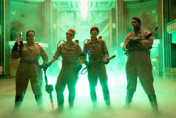 The three women in uniforms with ghost busting guns and foggy stuff around their feet