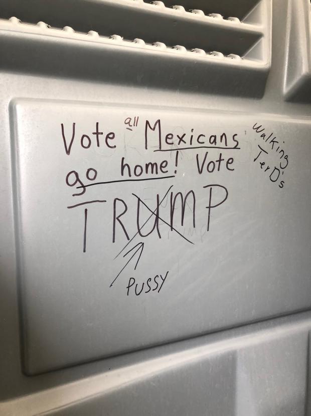 Graffiti that says Vote Mexicans go home, Vote Trump
