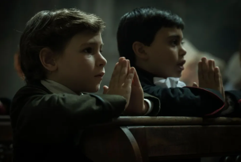 Two little boys praying