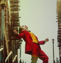 Movie poster from Joker movie with Joker outside leaning back with arms spread wide