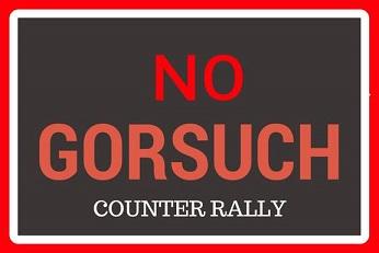 Red words on black saying No Gorsuch counter rally