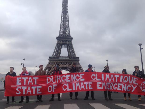 Eiffel Tower with big climate justice sign in front