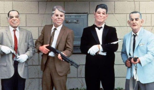 People dressed as presidents in masks with guns