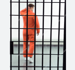 Prisoner behind bars