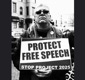  Man holding a sign saying Protect Free Speech Stop Project 2025