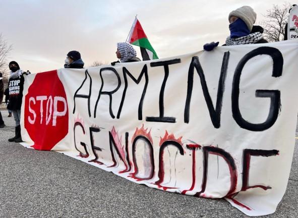 Banner saying Stop Arming Genocide