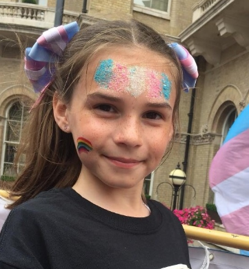 Young girl with trans flag