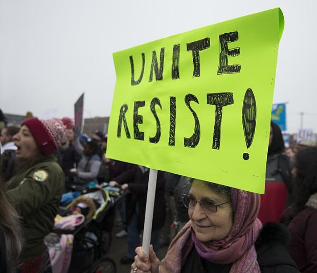 Sign at protest saying Unite Resist