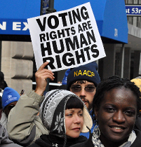 People and sign held high saying Voting Rights are Human Rights