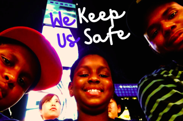 Young immigrant kids with word We keep us safe