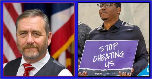 Daidi Yost & guy holding Stop Cheating Us sign