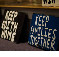 Two stark protest signs one saying Keep Edith Home and one saying  Keep Families Together
