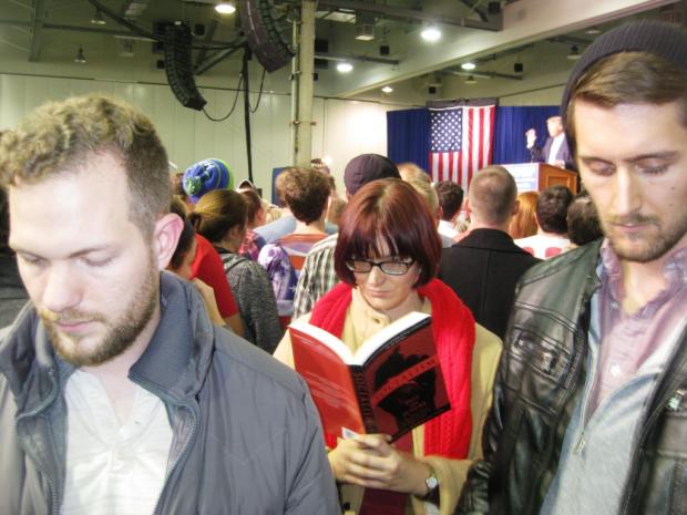 Kyle Landis, Hayley Cotter, and Jordan Patton catch up on their reading while Donald Trump speaks at the Greater Columbus Convention Center.
