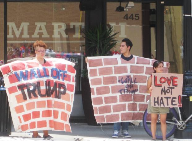Protesters demontrate across the street from Donald Trump’s town hall at the Columbus Convention Center on August 1.