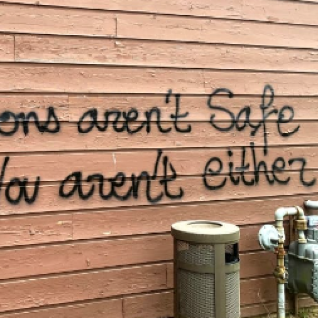 Spray painting on wall saying If abortions aren't safe you aren't either