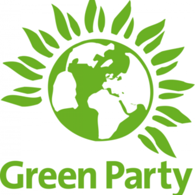 Green earth with leaves growing around it and words Green party