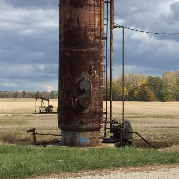 Tall metal structure out in a field - an injection well
