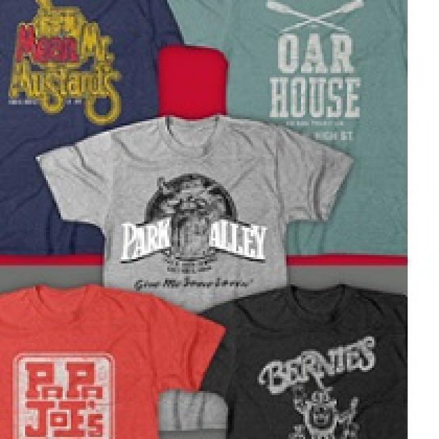 Five T-shirts laying out flat each with a different logo from a campus bar on it