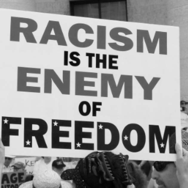Sign reading Racism is the Enemy of Freedom