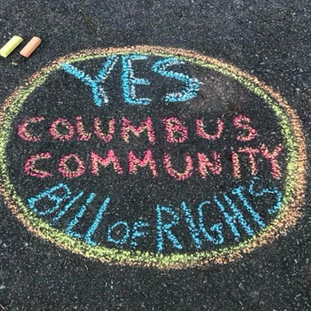 Chalk words on ground Yes Columbus Community Bill of Rights