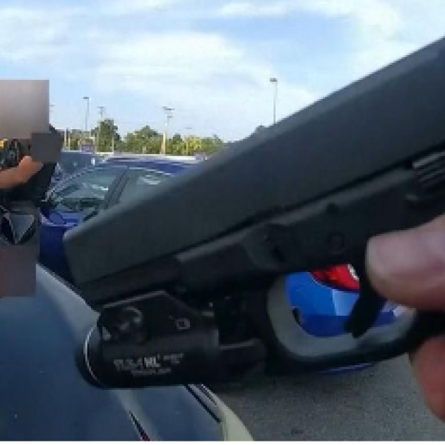 Gun aimed at car