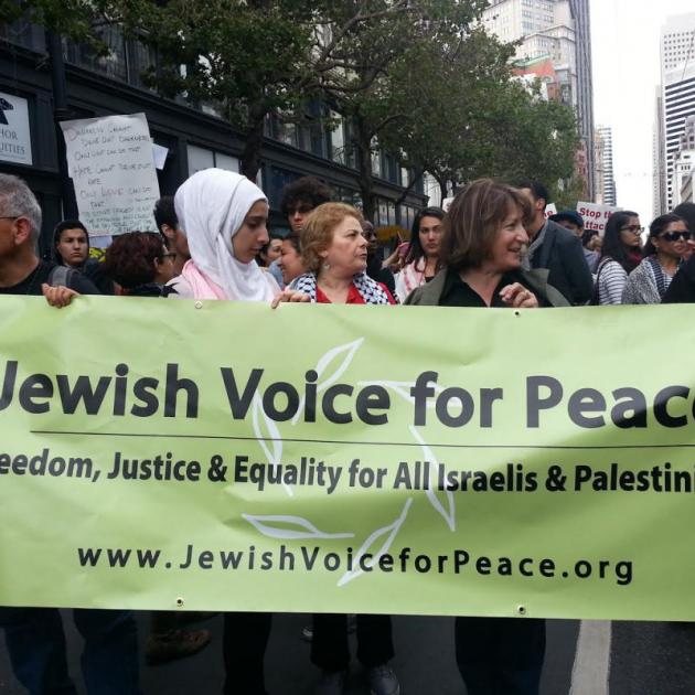 People holding a Jewish Vices for Peace banner