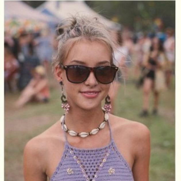 Young woman at outdoor festival wearing a shell necklace