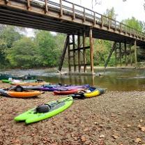 A river, a bridge and several kayaks