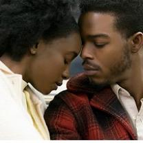 Black man and woman with eyes closed leaning their foreheads against each other