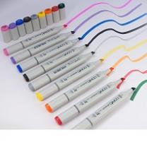 Lots of white handled thick marker pens all in a row making squiggly lines of different colors