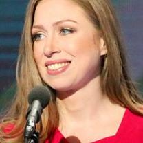 Chelsea Clinton wearing red at a microphone