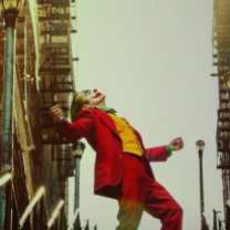 Movie poster from Joker movie with Joker outside leaning back with arms spread wide