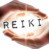 Two hands one on top one on bottom like they are holding the word Reiki which is glowing