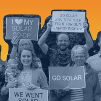 People holding signs about solar power