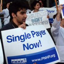 Guy holding Single Payer Now sign