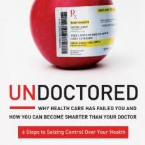 Cover of Undoctored book, with an apple with a prescription pasted on it
