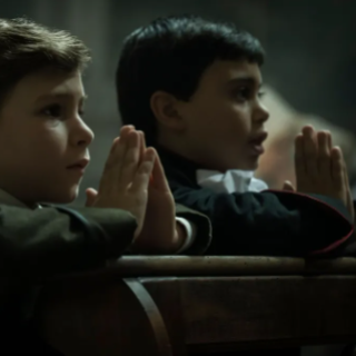 Two little boys praying