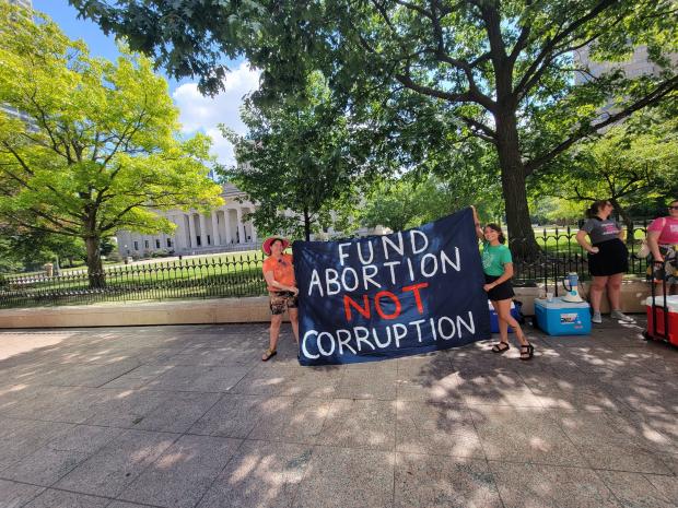 Sign saying Fund Abortion not Corruption