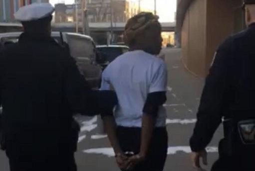Black woman being arrested