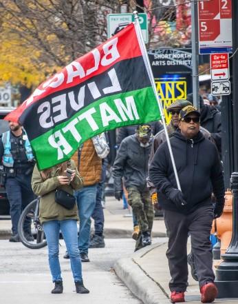 Marcher with Black Lives Matter flag