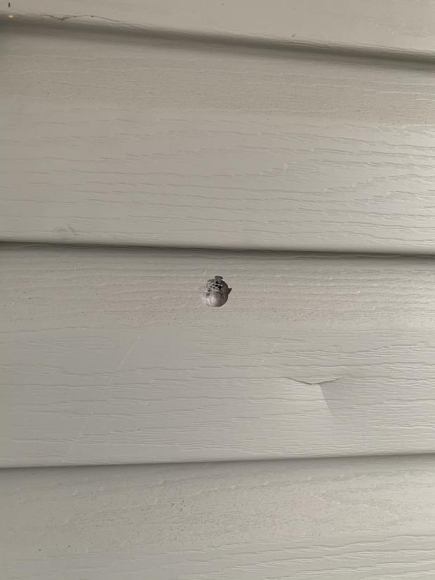 Bullet hole in house