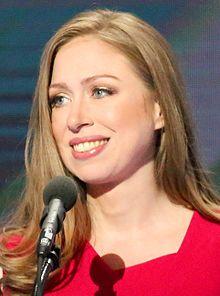 Chelsea Clinton wearing red at a microphone