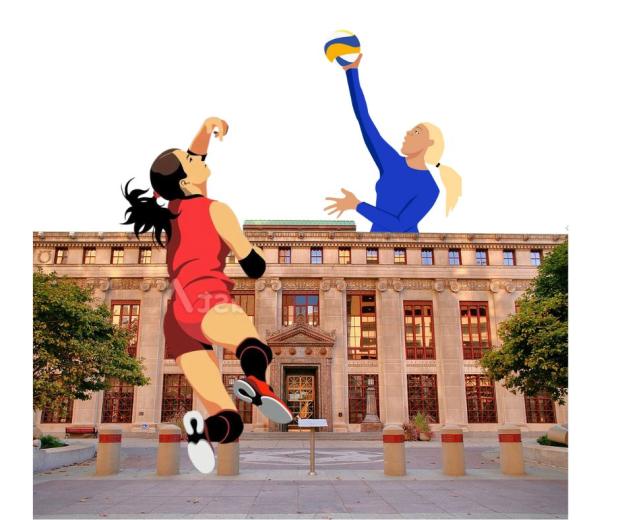 Two women playing volleyball on either side of City Hall